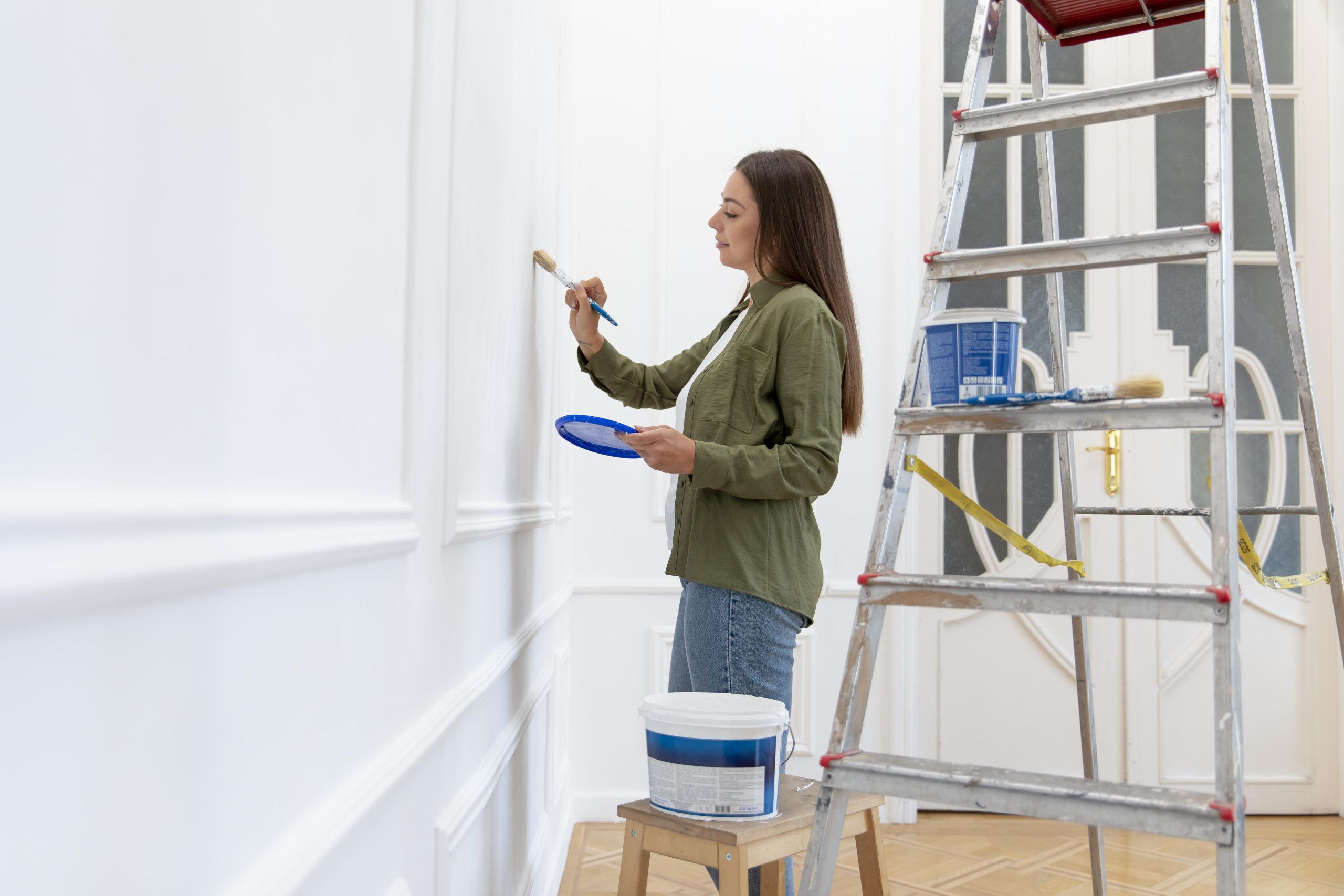 medium-shot-woman-painting-wall-home painting and detailing