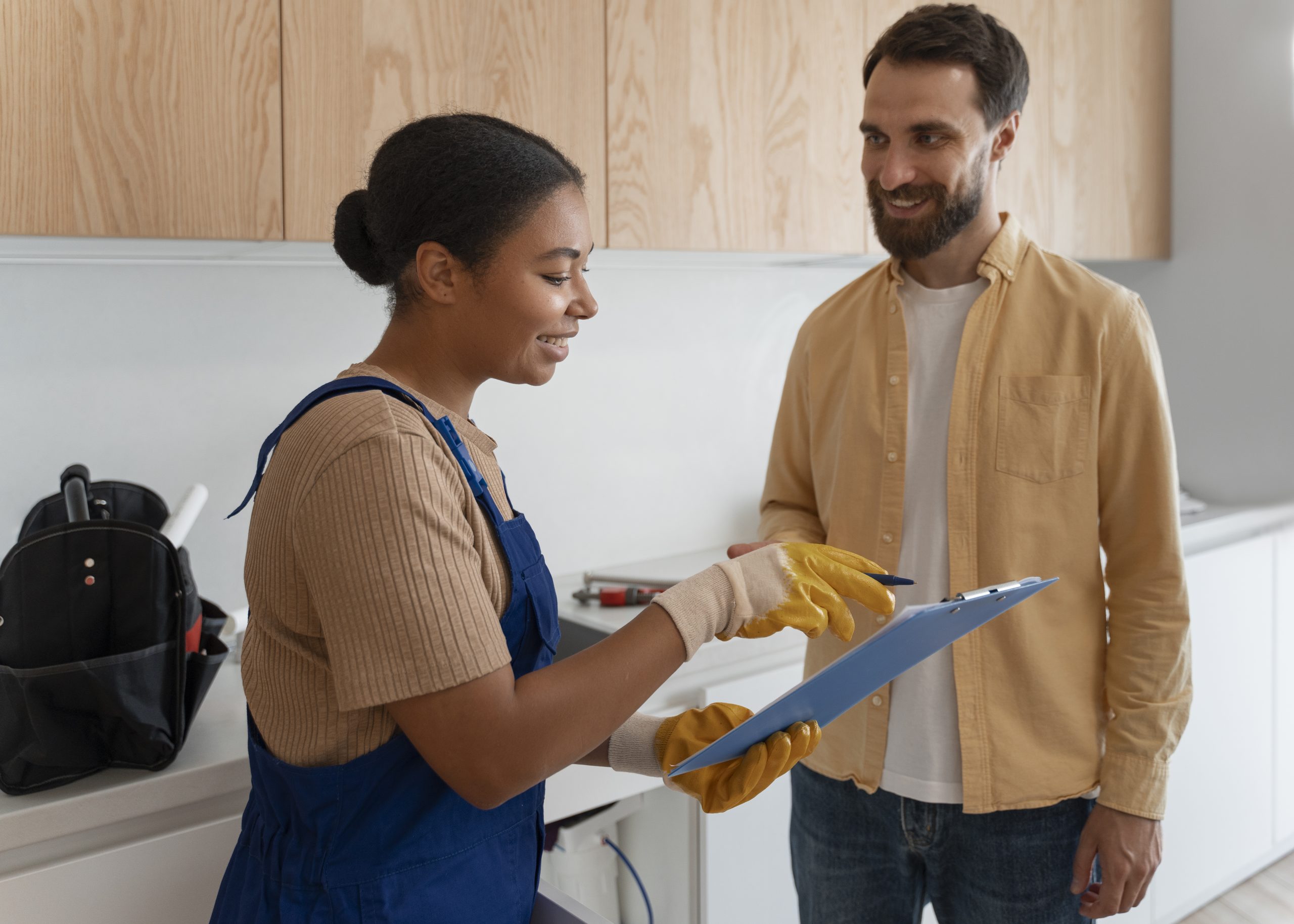 side-view-woman-working-as-plumber final inspection and clean up